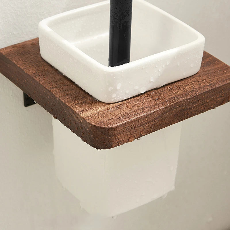 A close-up of a wall-mounted wooden toilet brush holder with a white ceramic container.