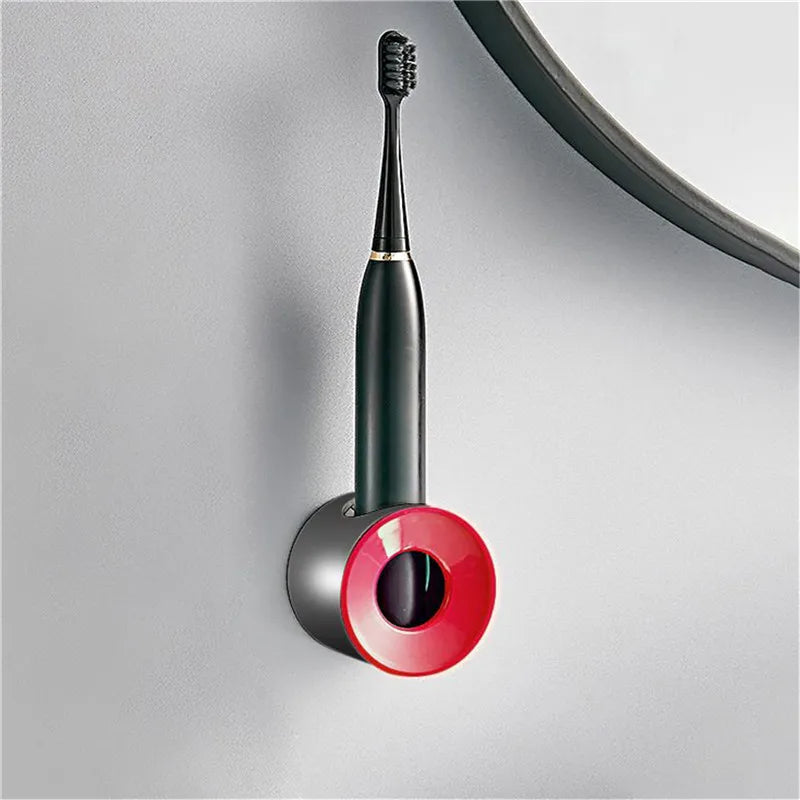 Toothbrush holder with red circular top mounted on wall holding toothbrush