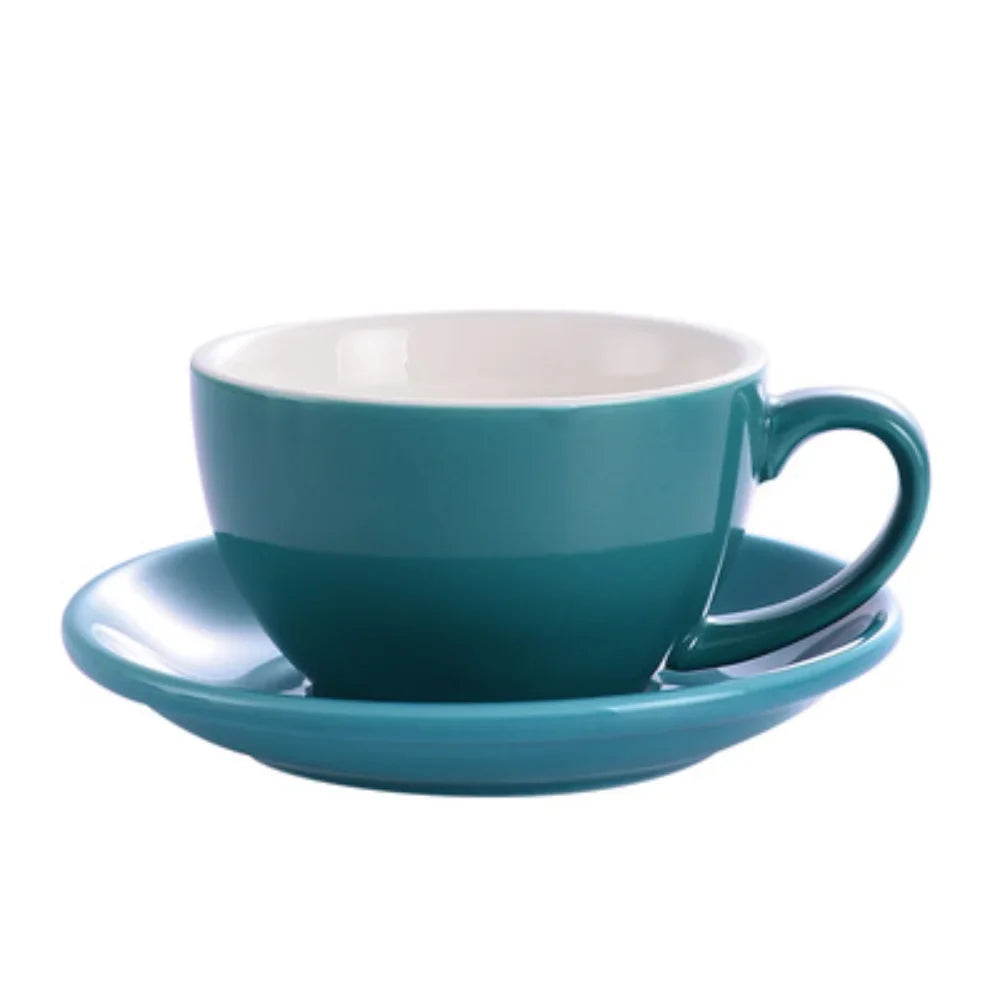 A teal ceramic mug with a white interior and matching saucer.