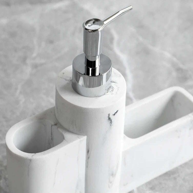 Close-up of white marble soap pump from the dispenser set.