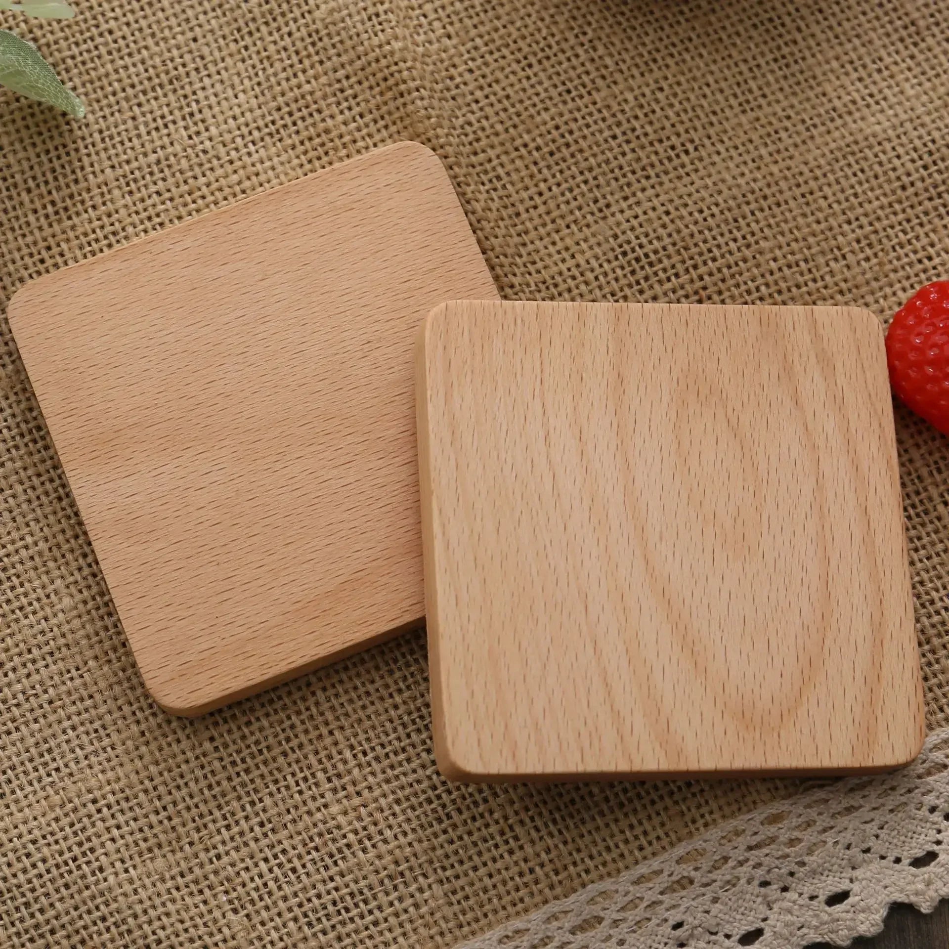 Dark brown round coaster holding a cup of tea – wooden coaster.