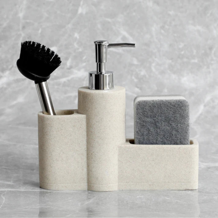 Beige dish soap dispenser set with brush and sponge.