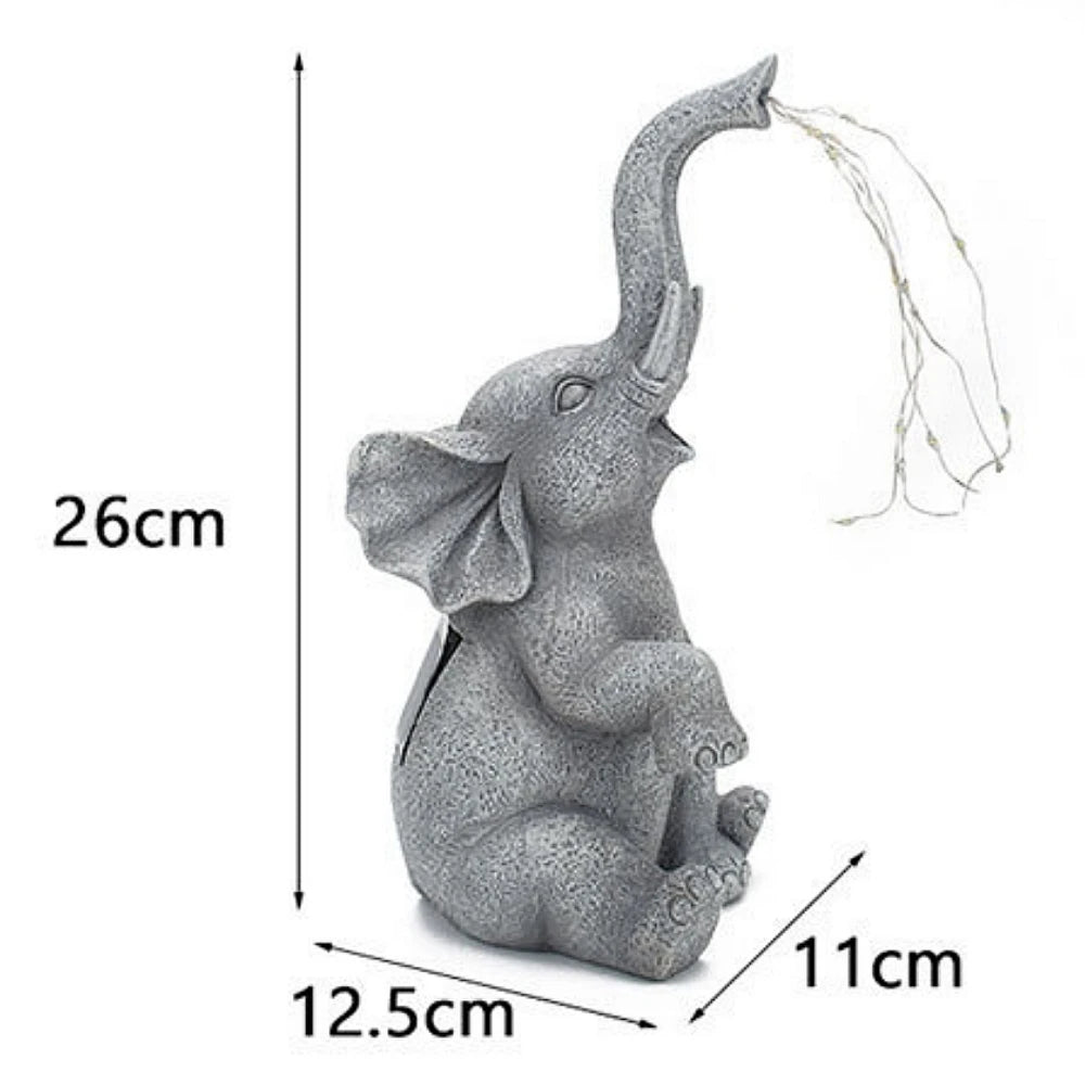 Product dimensions of elephant statues with light feature.