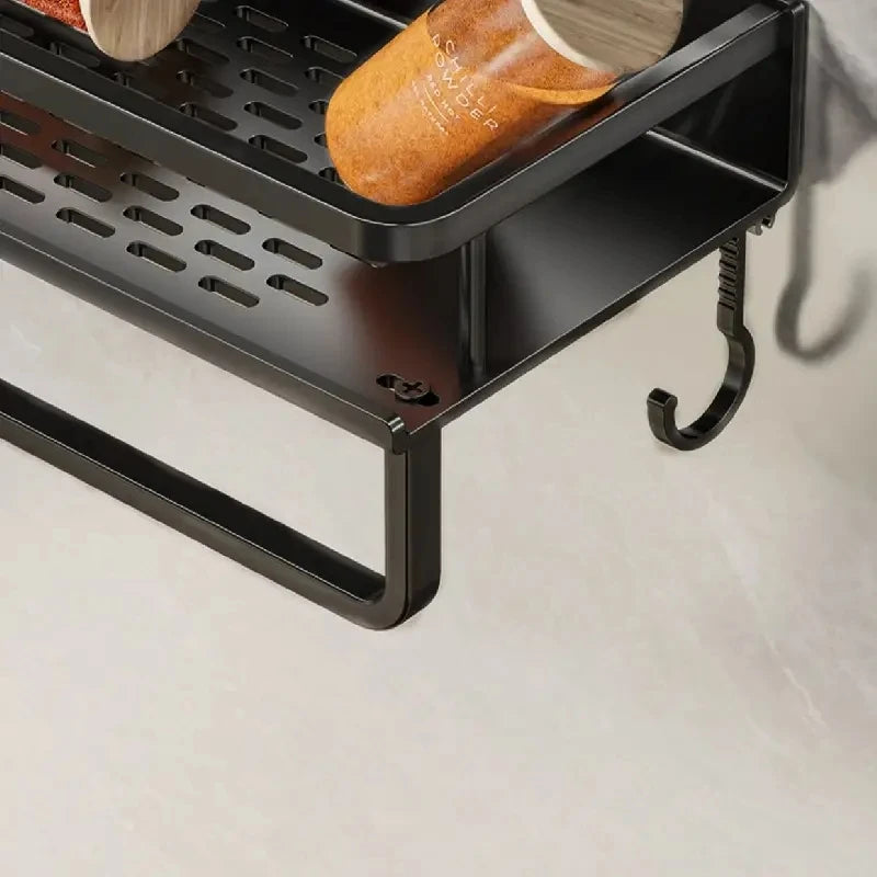 Close-up of black spice rack organizer corner with hanging hooks.