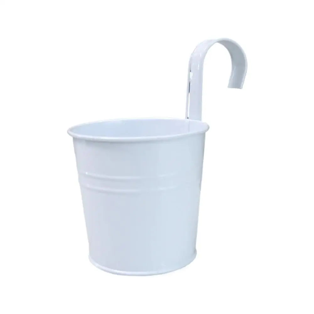 White hanging flower pot with handle, shown empty.