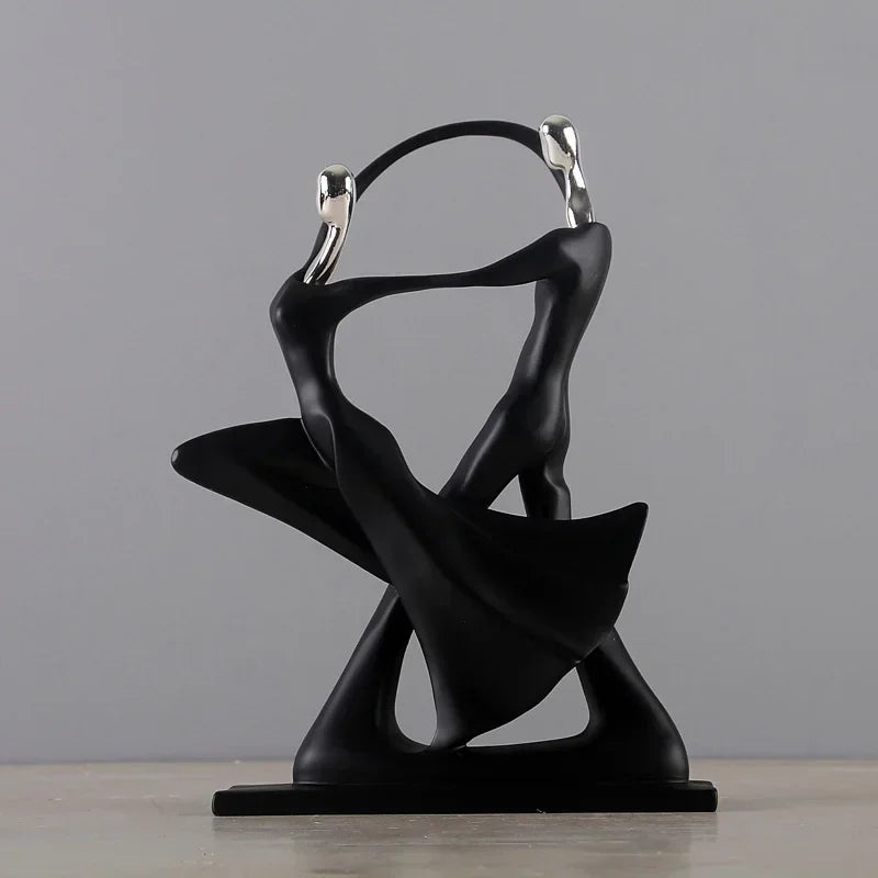 Black dancing figurine, dynamic pose.