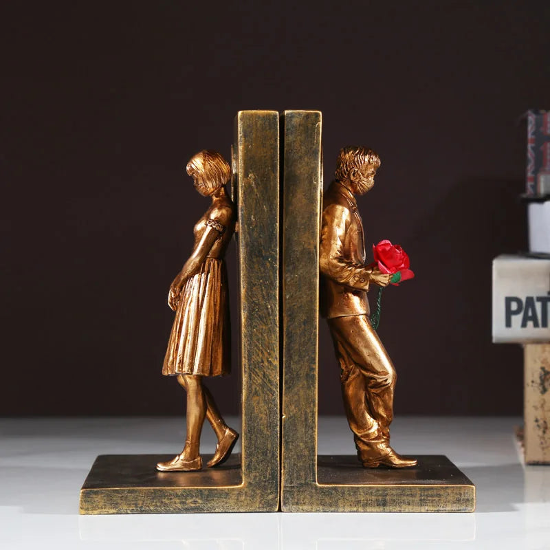 Bronze book stand, man and woman figures.