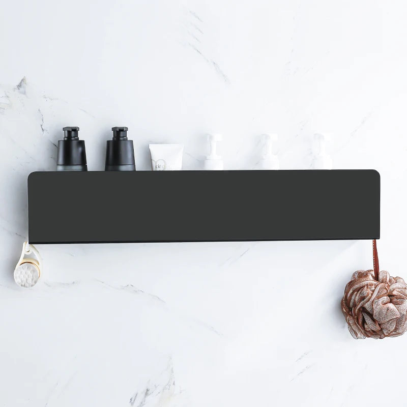Wide black bathroom organizer mounted on marble wall.