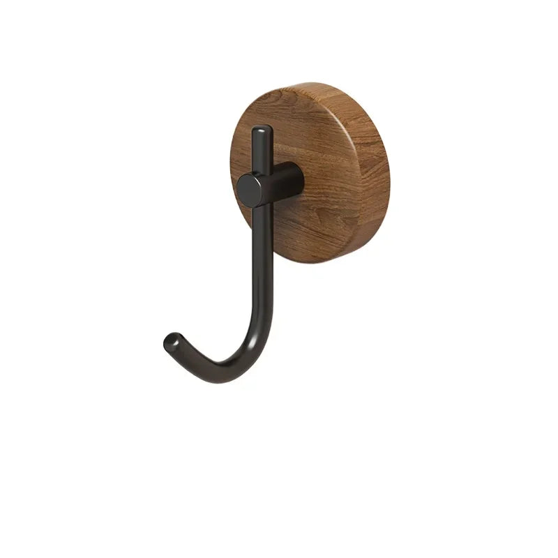 Simple wooden coat hook with a black metal arm.