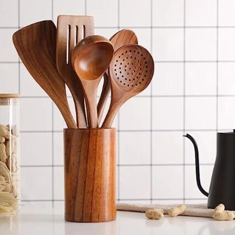 Cooking with wooden kitchenware set in a pot.