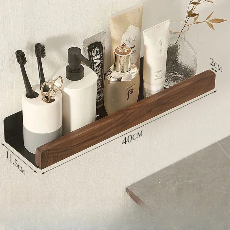 Floating wood shelf holding various bathroom products and showing dimensions.