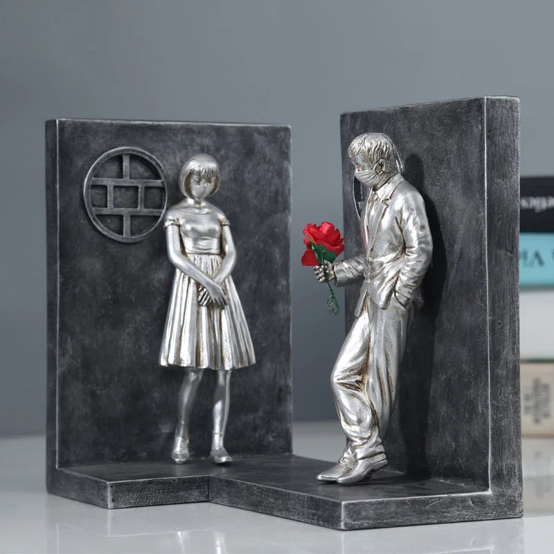 Silver book stand with male figure.